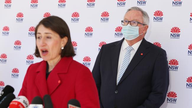 NSW Minister for Health Brad Hazzard looks on as Premier Gladys Berejiklian speaks during a COVID-19 update.