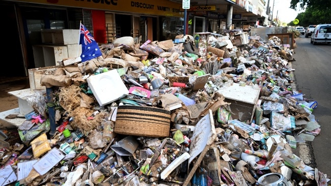 Sidewalks are littered with tonnes of destroyed furniture, white goods and household items. Picture: Getty Images