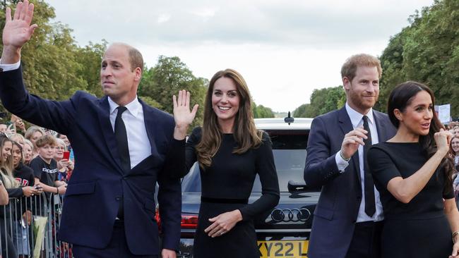 Prince Harry was seen close by Meghan’s side during the walkabout. Picture: AFP