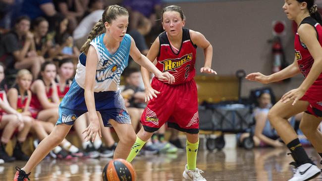 Central Coast Waves player Ella Morgan on the attack during the under-14 women’s basketball playoff against Gosford City Rebels at Breakers Indoor Sports Stadium, Terrigal, on Sunday. Picture: Troy Snook