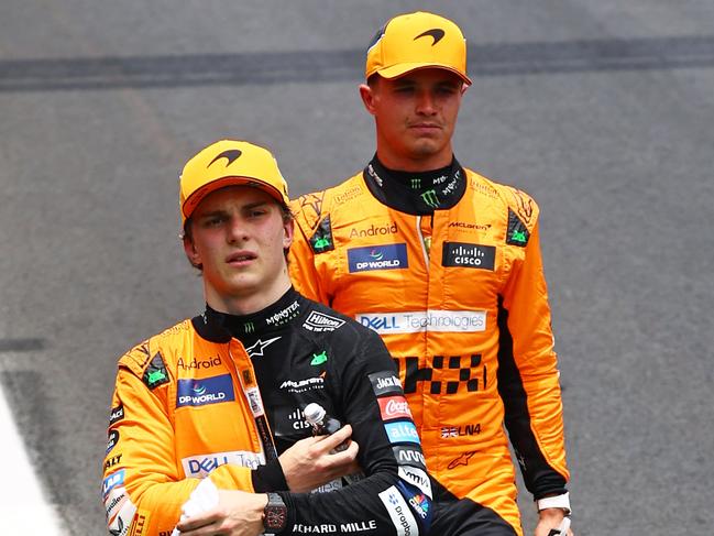 SAO PAULO, BRAZIL - NOVEMBER 02: Sprint winner Lando Norris of Great Britain and McLaren and Second placed Oscar Piastri of Australia and McLaren walk in parc ferme during the Sprint ahead of the F1 Grand Prix of Brazil at Autodromo Jose Carlos Pace on November 02, 2024 in Sao Paulo, Brazil. (Photo by Mark Thompson/Getty Images)