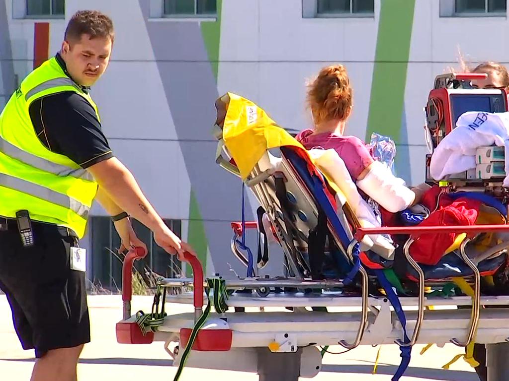 A woman is transported to Hervey Bay Hospital after a dingo attack on K'Gari. Picture: Channel 7