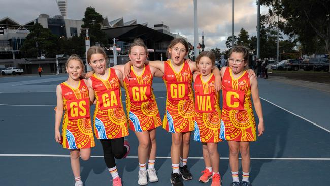 Surf Coast Suns Addis under-11 netball team pull their funniest faces.