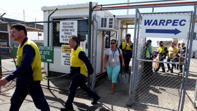 Sad day ... Ford workers leave the factory after being told of the job cuts at the Broadmeadows plant.