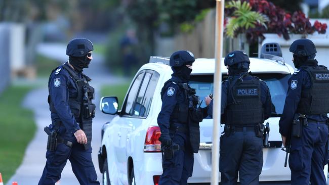 Police at the scene of a siege at Alexandra Headlands. Picture: AAP/Darren England