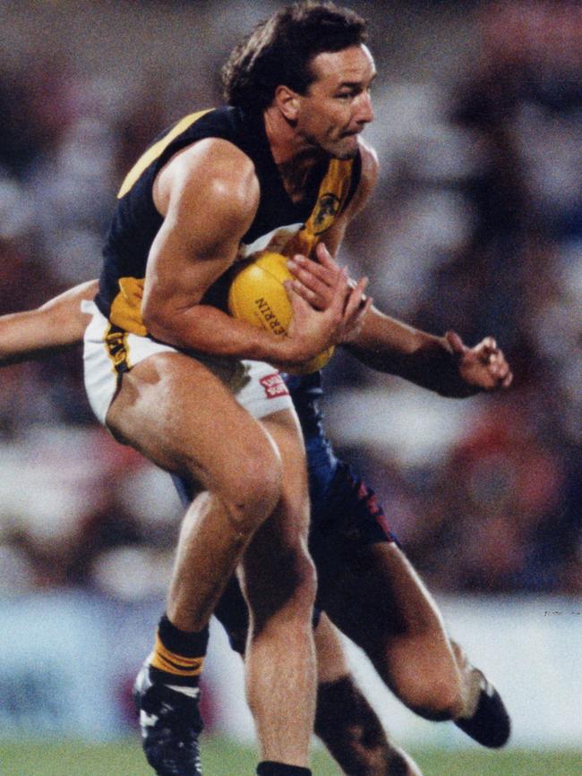 Glenelg’s Jim West marks the football at Footy Park. Picture: Ray Titus 