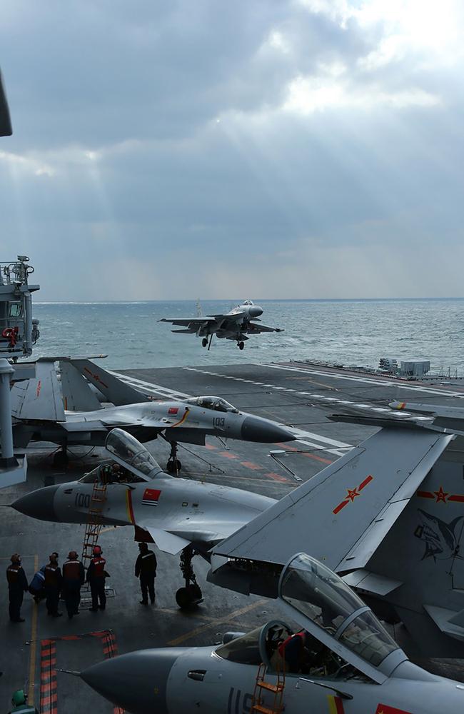 Chinese J-15 fighter jets on the deck of the Liaoning aircraft carrier during drills in the Yellow Sea, off China's east coast. Picture: AFP