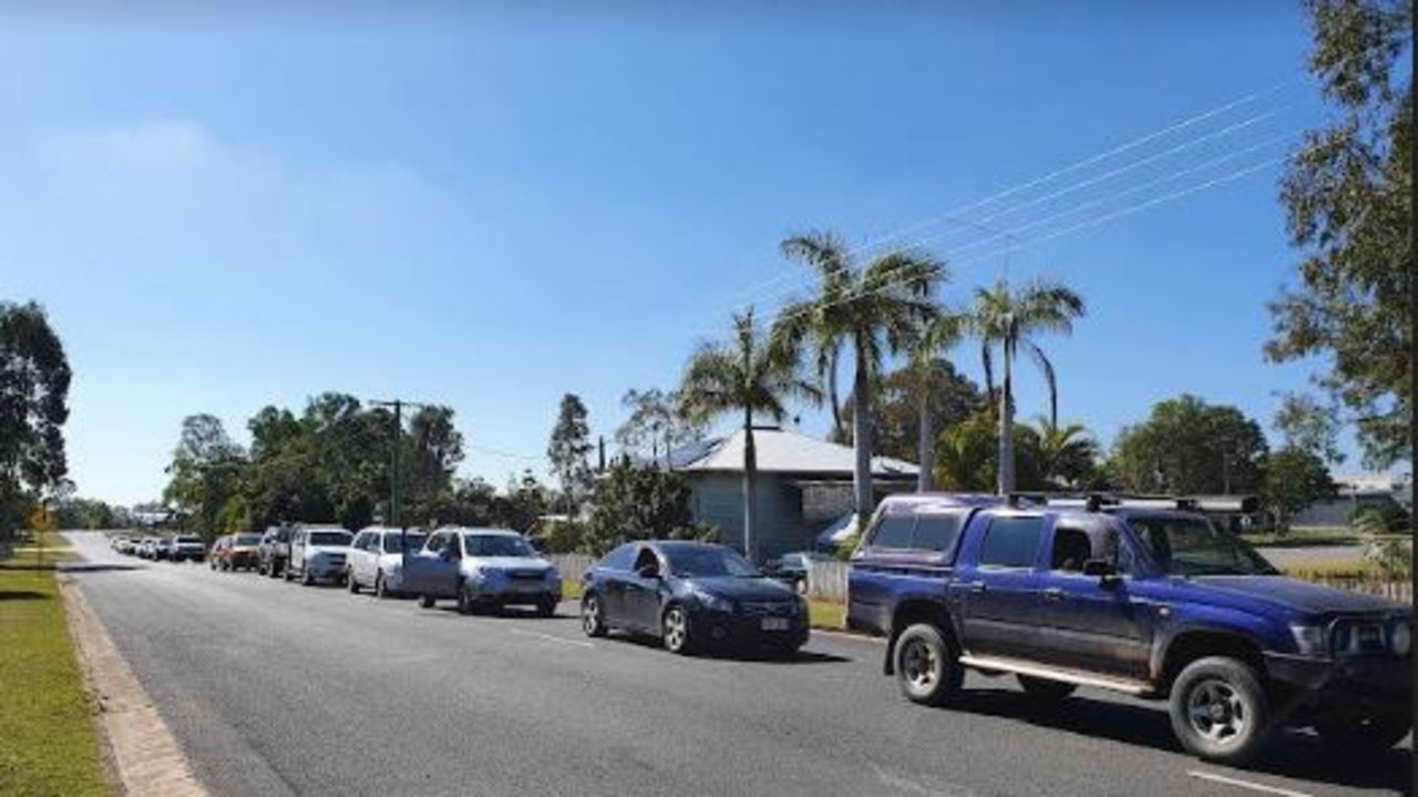 The line Yaralla Street for the Maryborough Fever Clinic on Monday morning.