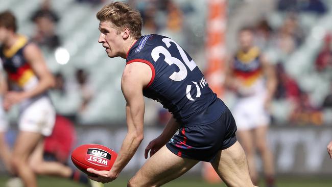 Dylan Stephens readies himself to handball during SANFL finals.