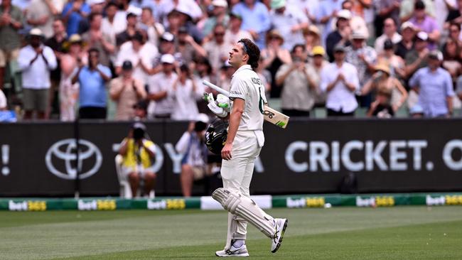 Sam Konstas takes it all in as he walks off to a deafening ovation after his dismissal. Picture: AFP