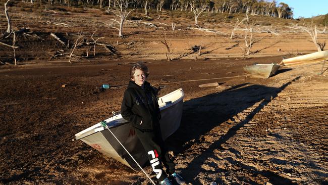 Rhylan Basford and his father Andrew have been coming to Lake Eucumbene all their lives. Now it’s ‘just a river’, says Rhylan’s grandfather. Picture: Kym Smith