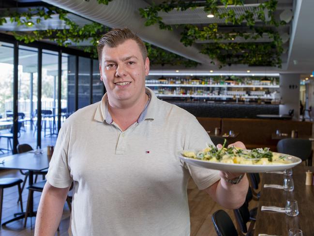 Restaurant manager Kane Galvin holding the potato and parsley gnocchi dish at Mozzafiato @ Elite in Carrara. Picture: Jerad Williams.