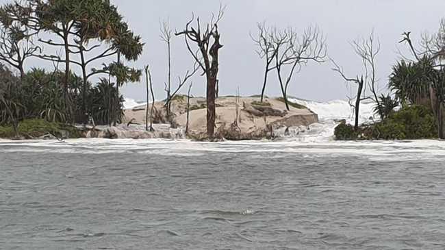 The next hour will be crucial in protecting Pumicestone Passage and Golden beach after a 2m wide and 1m deep hole broke through Bribie island’s banks. Picture: Joel Sheppard.