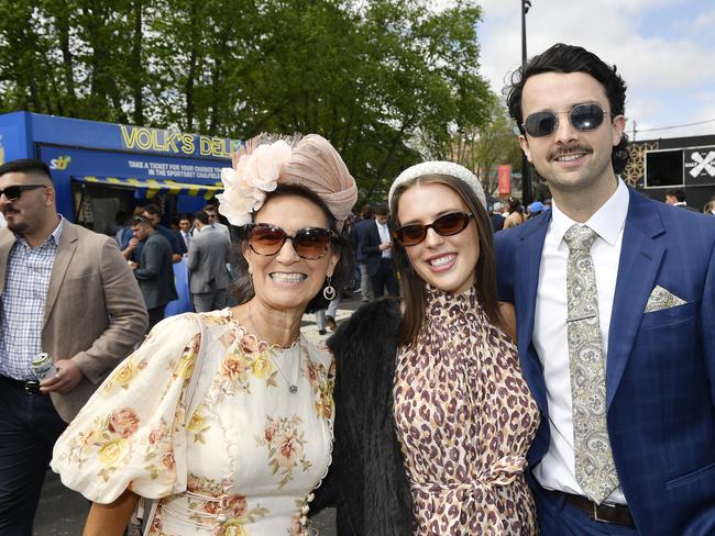 Sportsbet Caulfield Cup Carnival at Caulfield racecourse, Caulfield, Victoria, Saturday 19th October 2024. Racegoers enjoying the meeting are Sharon Polson, Isabella Paturzo and Tom Bruce. Picture: Andrew Batsch