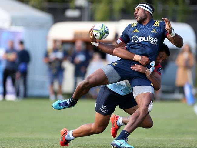 Tevita Nabura of the Highlanders is tackled by Curtis Rona of the Waratahs.