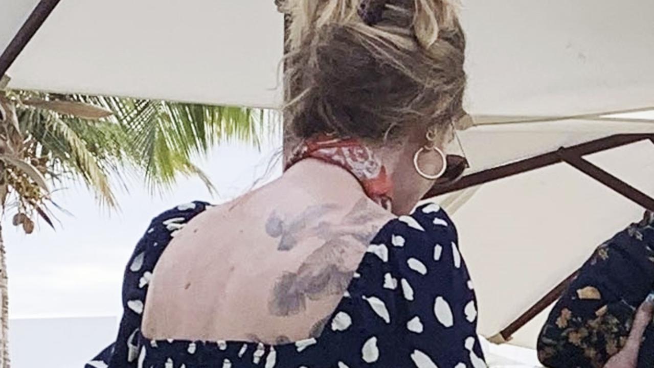 Adele shows off back tattoo in new weight loss photos  —  Australia's leading news site
