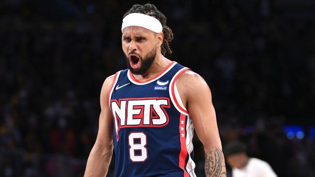 LOS ANGELES, CA - DECEMBER 25: Patty Mills #8 of the Brooklyn Nets reacts after a three-point basket in the second half of the game against the Los Angeles Lakers at Crypto.com Arena on December 25, 2021 in Los Angeles, California. NOTE TO USER: User expressly acknowledges and agrees that, by downloading and/or using this Photograph, user is consenting to the terms and conditions of the Getty Images License Agreement.   Jayne Kamin-Oncea/Getty Images/AFP == FOR NEWSPAPERS, INTERNET, TELCOS & TELEVISION USE ONLY ==
