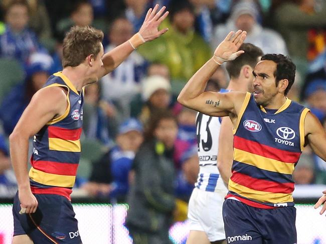 Eddie Betts high fives a teammate after a goal.