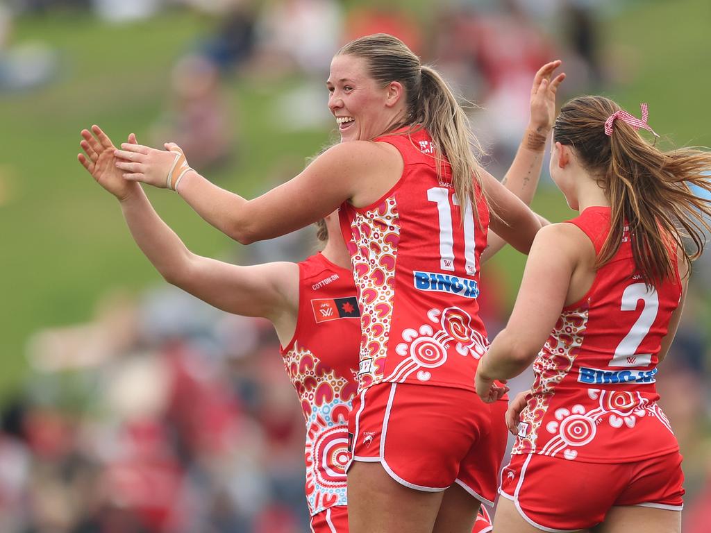 Bella Smith celebrates a goal for the Swans.