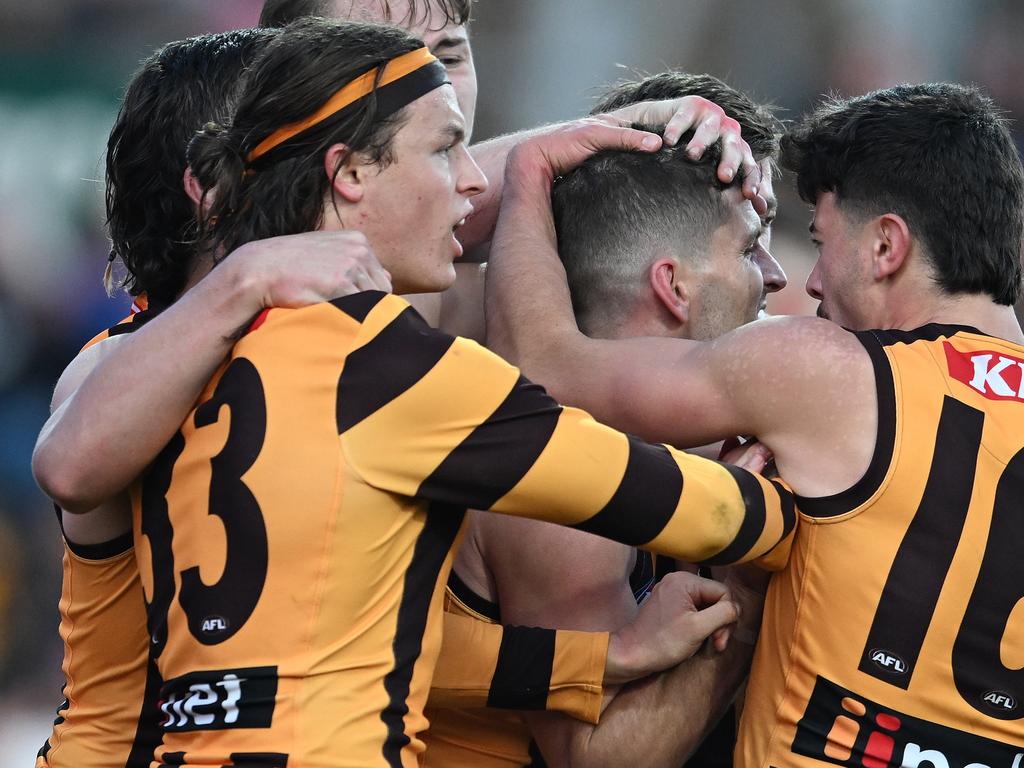 LAUNCESTON, AUSTRALIA – JUNE 08: Luke Breust of the Hawks is congratulated by teammates during the round 13 AFL match between Hawthorn Hawks and GWS GIANTS at University of Tasmania Stadium, on June 08, 2024, in Launceston, Australia. (Photo by Steve Bell/Getty Images)