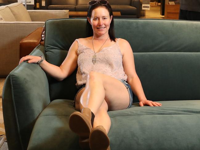 Stephanie Bellm, 42, looking at furniture with Nick Scali Assistant Store Manager Kevin Parkinson, Fortitude Valley. Photographer: Liam Kidston.