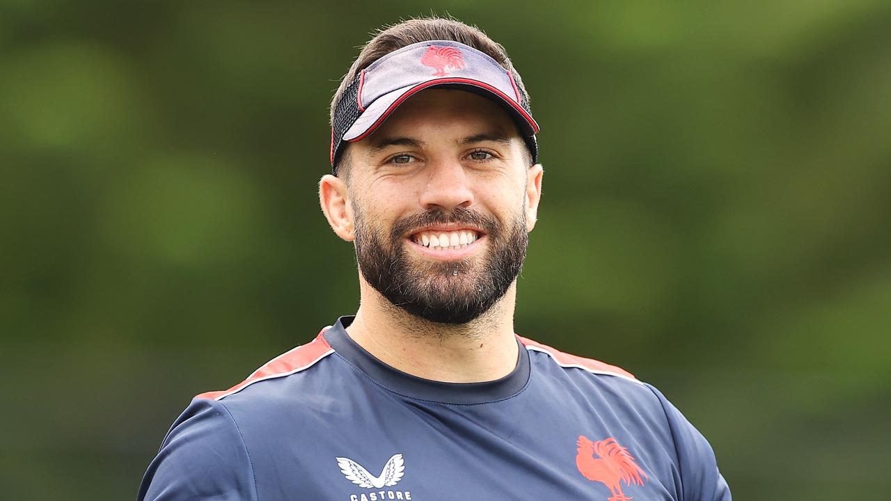 SYDNEY, AUSTRALIA - MARCH 07: James Tedesco shares a laugh with a teammate during a Sydney Roosters NRL training session at Robertson Road Synthetic Field on March 07, 2022 in Sydney, Australia. (Photo by Mark Kolbe/Getty Images)