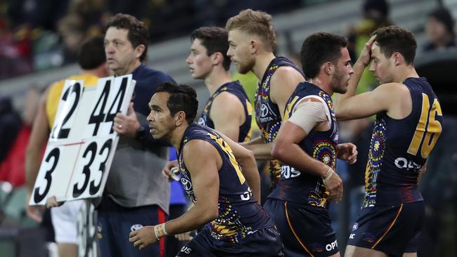 The Crows interchange bench on Saturday. Does the AFL need to scrap the cap? Picture Sarah Reed