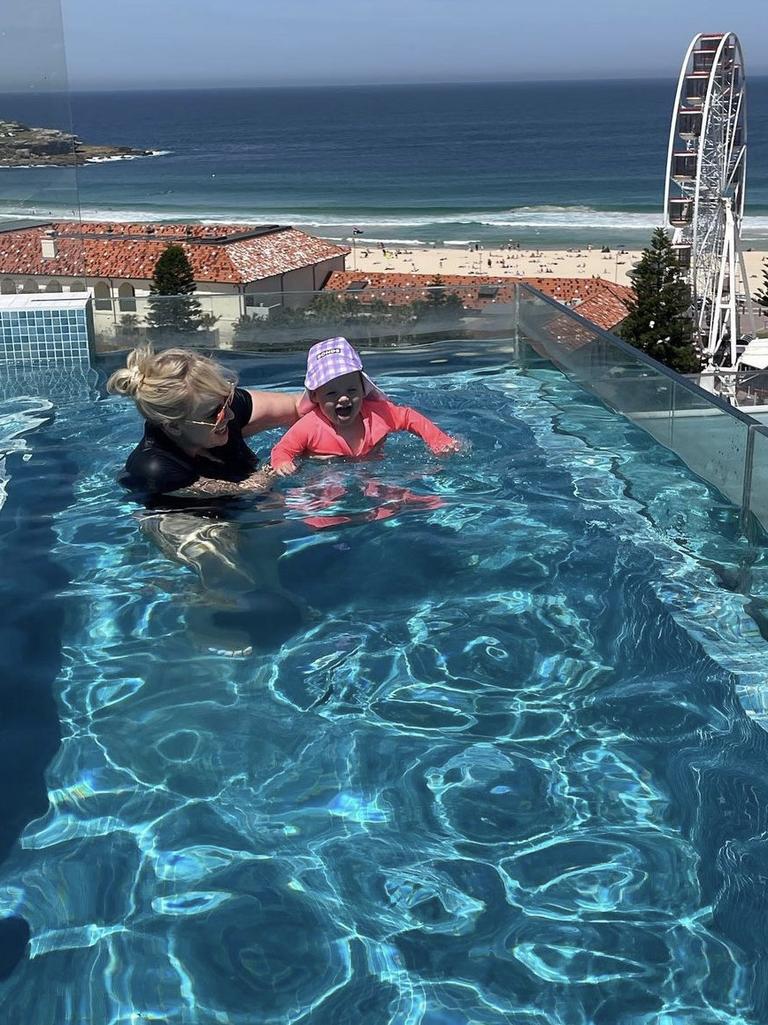 Rebel pictured with her one-year-old daughter Royce in the home’s swimming pool.