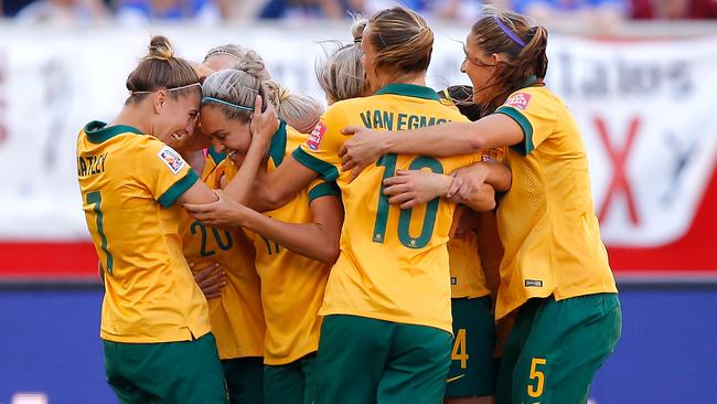 Kyah Simon (second left) celebrates scoring against Nigeria at the 2015 Women’s World Cup in Canada. Total prizemoney for that tournament was US$15m. Picture: Getty Images 