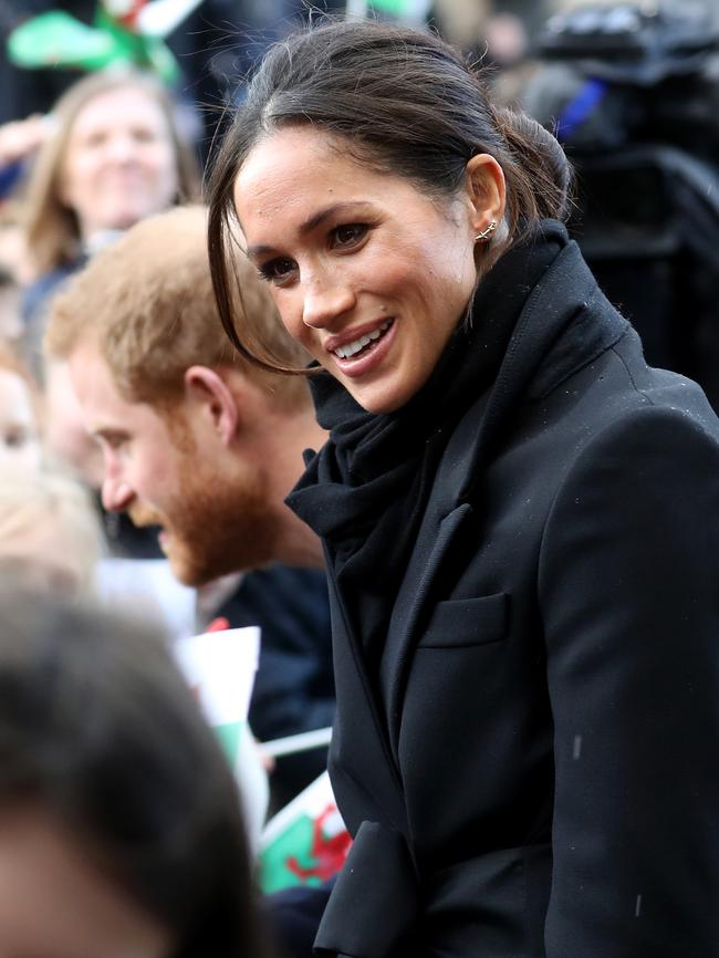 Prince Harry and Meghan Markle are seen during a walkabout at Cardiff Castle on January 18, 2018 in Cardiff, Wales. Picture: Getty