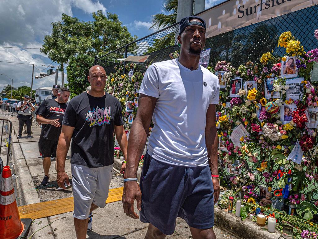 Bam Adebayo of the Miami Heat basketball team walks next to the 'Surfside Wall of Hope &amp; Memorial'. (Photo by Giorgio Viera / AFP)
