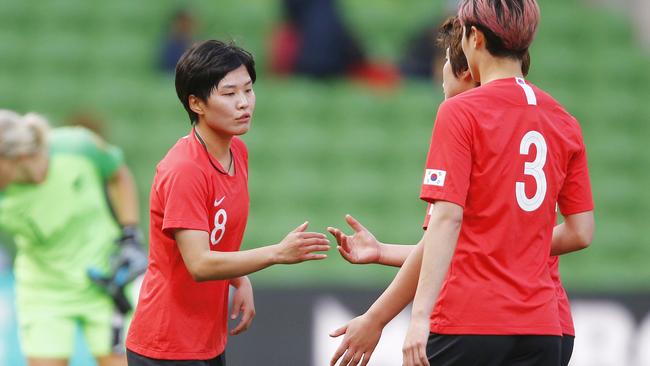 Ji So-yun of Korea Republic (centre) celebrates with teammates whilst New Zealand players look dejected after the Cup of Nations football match between Korea Republic and New Zealand at AAMI Park in Melbourne, Wednesday, March 6, 2019. (AAP Image/Daniel Pockett) NO ARCHIVING, EDITORIAL USE ONLY