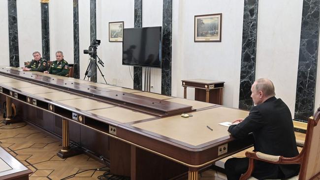 Vladimir Putin gives Valery Gerasimov, far left, and Defence Minister Sergei Shoigu instructions to put the country's nuclear ‘deterrence forces’ on high alert on February 27. Picture: AFP