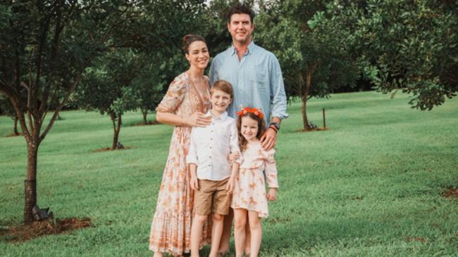 Giaan Rooney, husband Sam Levett, daughter Alexa, son Zander and dog Roy on their farm. Picture: Joe Paine