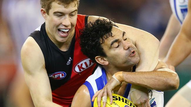 Lindsay Thomas is caught high by Essendon’s Zach Merrett. Picture: Michael Klein