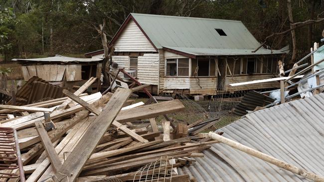 The house on Lake St in North Lismore was washed 50 metres into their neighbours’ backyard by the flooding Wilsons River. Picture: Jonathan Ng