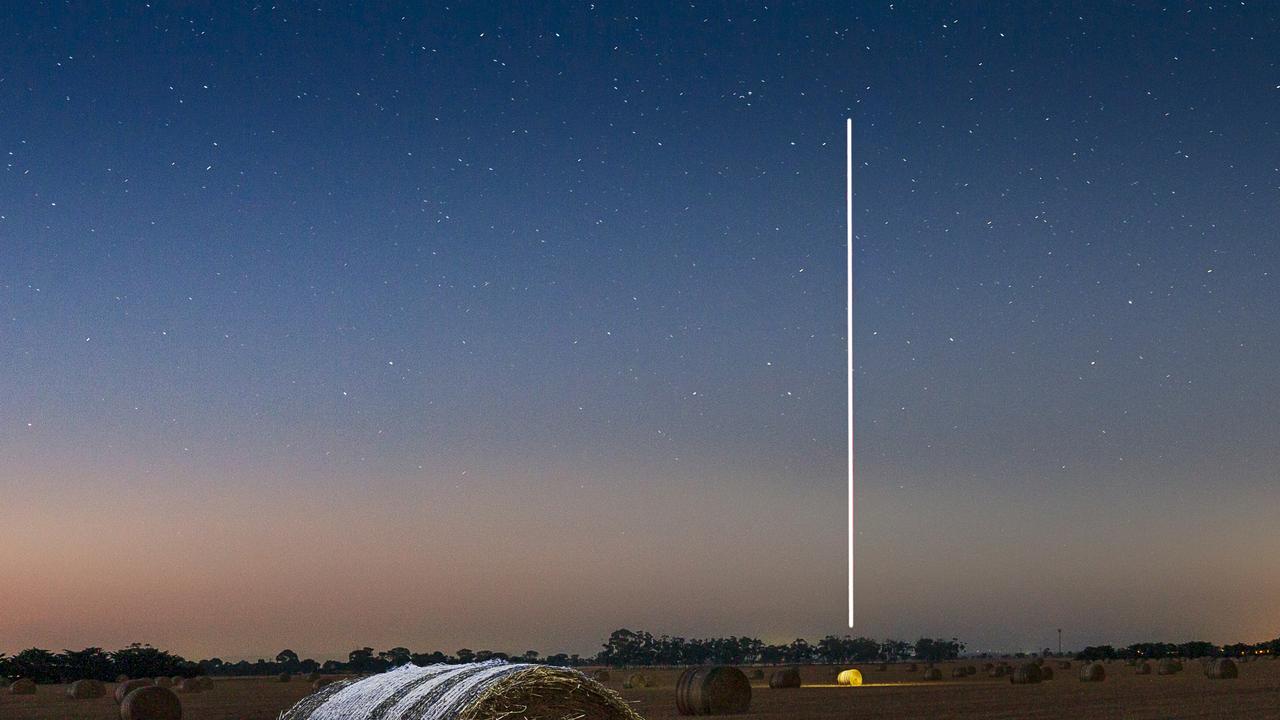 EMBARGO FOR TWAM 03 DECEMBER 2022. FEE MAY APPLY.  Photo of a hay bale, and light painting with a drone in Bacchus Marsh, VIC. Photo: Danielle Watson/Supplied