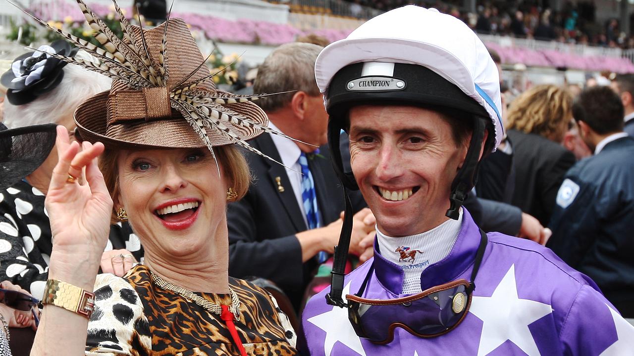 Trainer Gai Waterhouse (L) celebrates with jockey Nash Rawiller's 6th win with horse 'Theseon' during Victory Derby Day at Flemington Racecourse, Melbourne.
