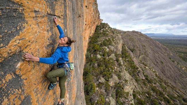 Rock climber Kerrin Gale scales the mighty 'Taipan Wall' on the "Dance of Life" climb in the Grampians. Picture: Simon Carter/The Australian