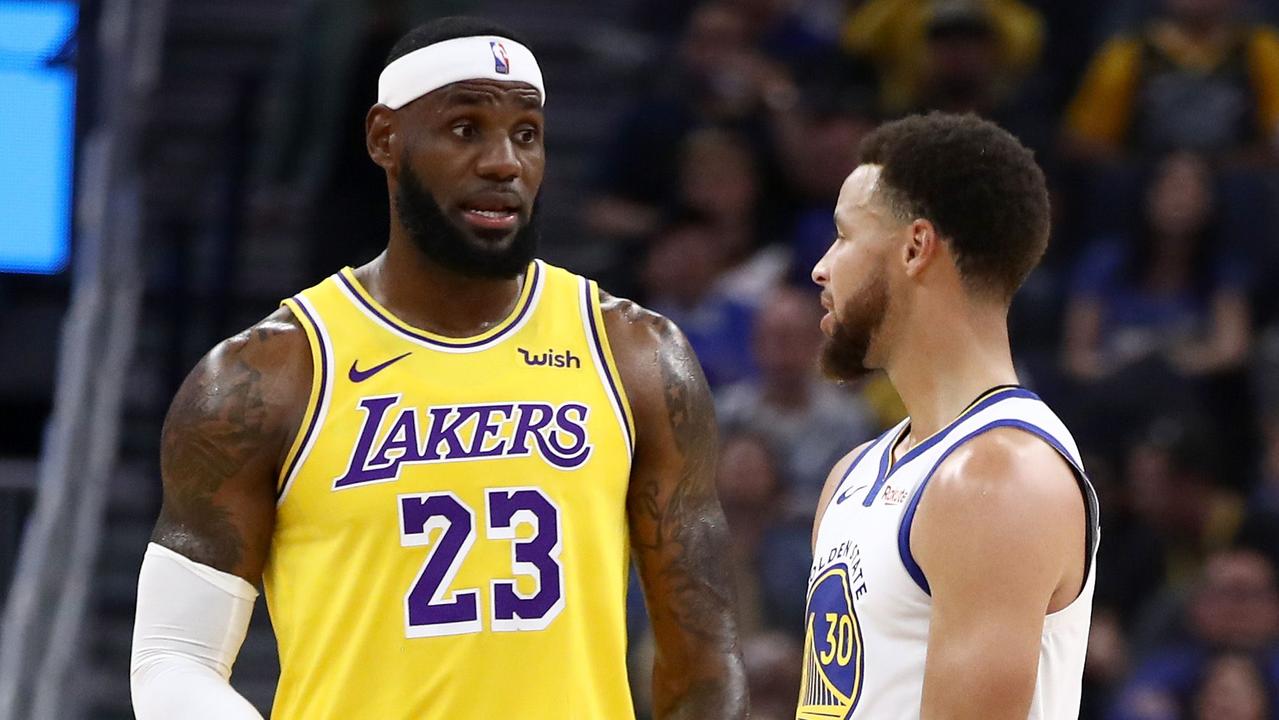 LeBron James and Steph Curry. (Photo by EZRA SHAW / GETTY IMAGES NORTH AMERICA / AFP)