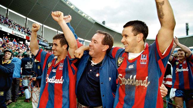 (L-R) Andrew, Gary and Matty Johns after the Knights’ 1997 grand final win Picture: Fairfax media