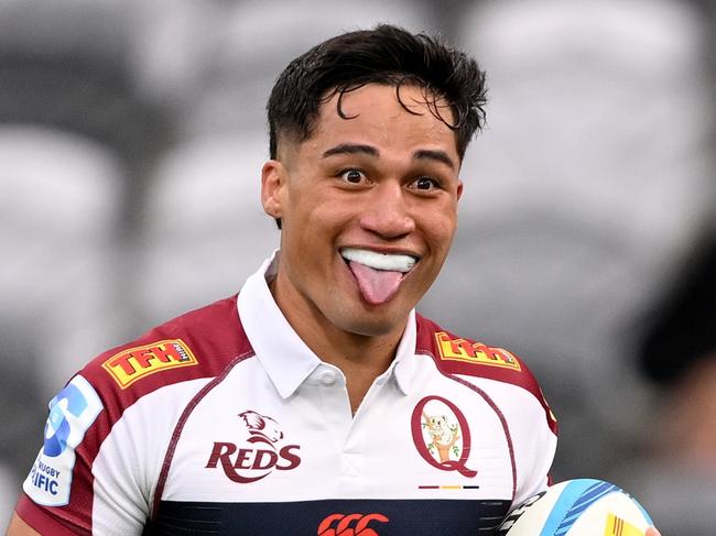 DUNEDIN, NEW ZEALAND - MARCH 22: Kalani Thomas of the Reds  charges over the tryline to score during the round six Super Rugby Pacific match between Highlanders and Queensland Reds at Forsyth Barr Stadium, on March 22, 2025, in Dunedin, New Zealand. (Photo by Joe Allison/Getty Images)