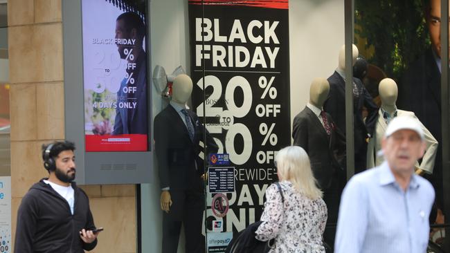 Posters boast of Black Friday bargains. Picture: AAP