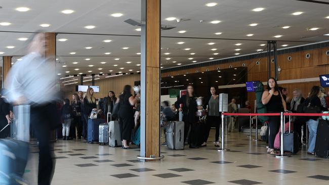 People queuing to check in at Hobart Airport. Picture: LUKE BOWDEN