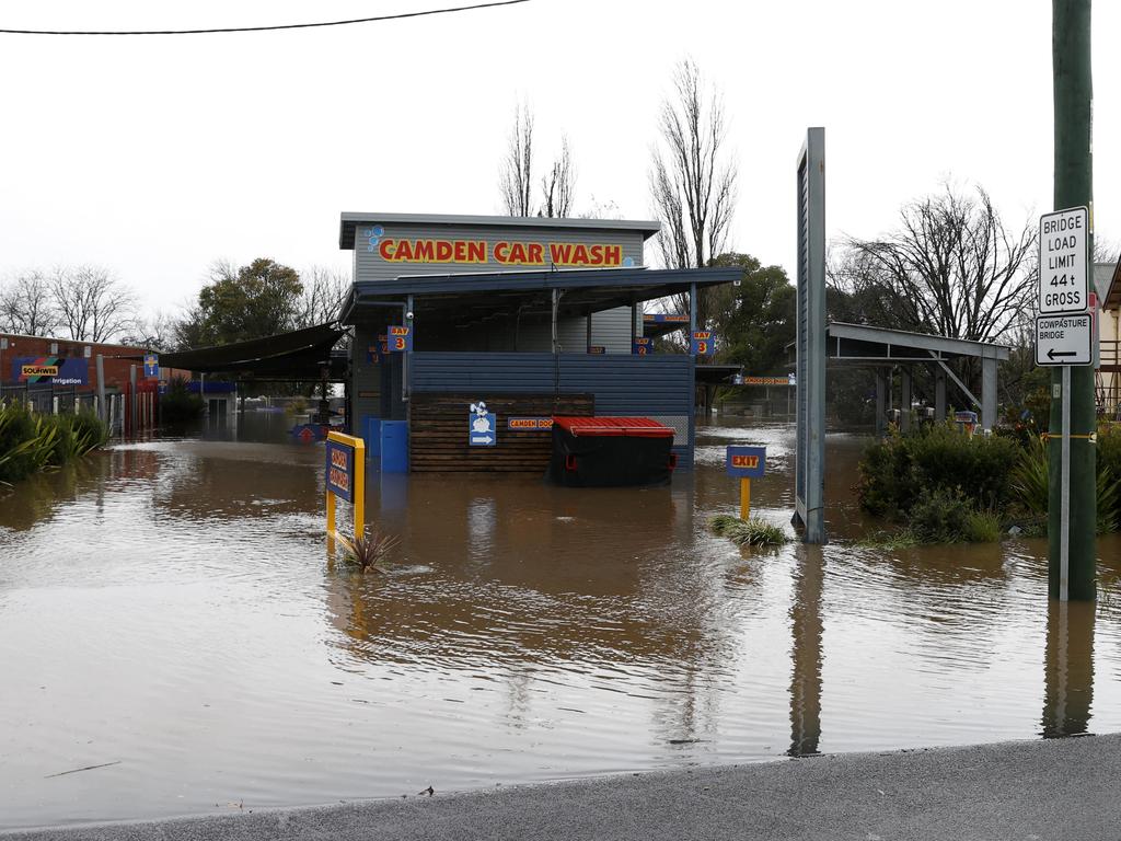 Businesses on Argyle St in Camden were underwater on Sunday morning, with an evacuation order in place. Picture: Jonathan Ng