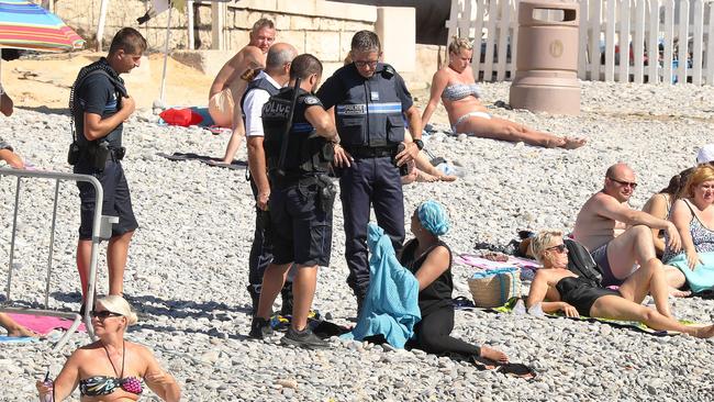 According to reports, the officers forced her to remove her shirt.