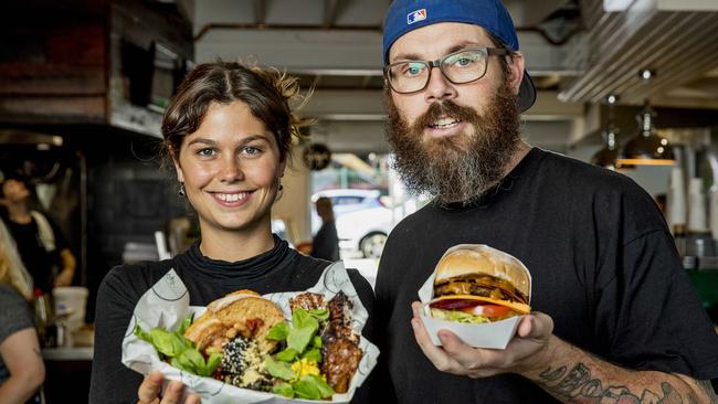 The LC Miami — Josie Zavadil holding the Breakfast box from Flora by Greenhouse Canteen and Jim Washington holding the Big BVK from BVK (Burgers Vs Kebabs). Picture: Jerad Williams