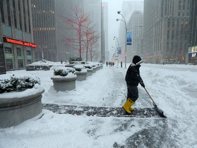 Heavy work ... Winter storm Jonas brings heavy snow and blizzard conditions to New York City. Mid-town Manhattan. Picture: Nathan Edwards