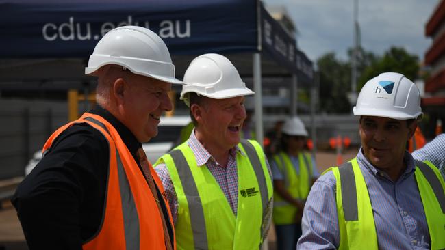 Minister Kirby, CDU vice-chancellor Scott Bowman with workers at the construction site for Charles Darwin University's new city campus. Picture: (A)manda Parkinson