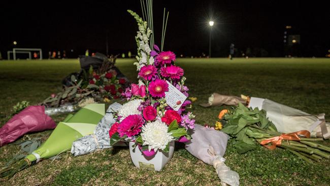 Flowers are left for Eurydice Dixon. Picture: Jake Nowakowski